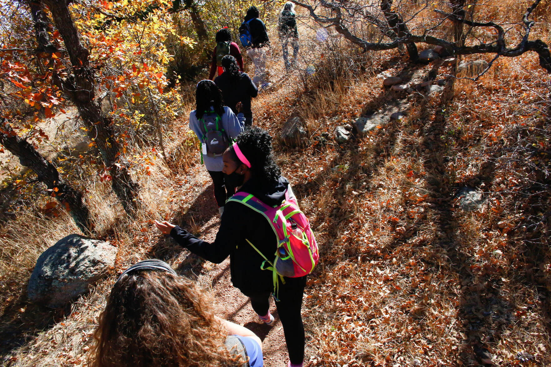 Members of Vibe Tribe Adventures, an organization founded in Colorado to encourage Black women to participate in outdoor activities, hike through Bear Creek Regional Park in Colorado Springs, Colorado, on Oct. 24, 2020.